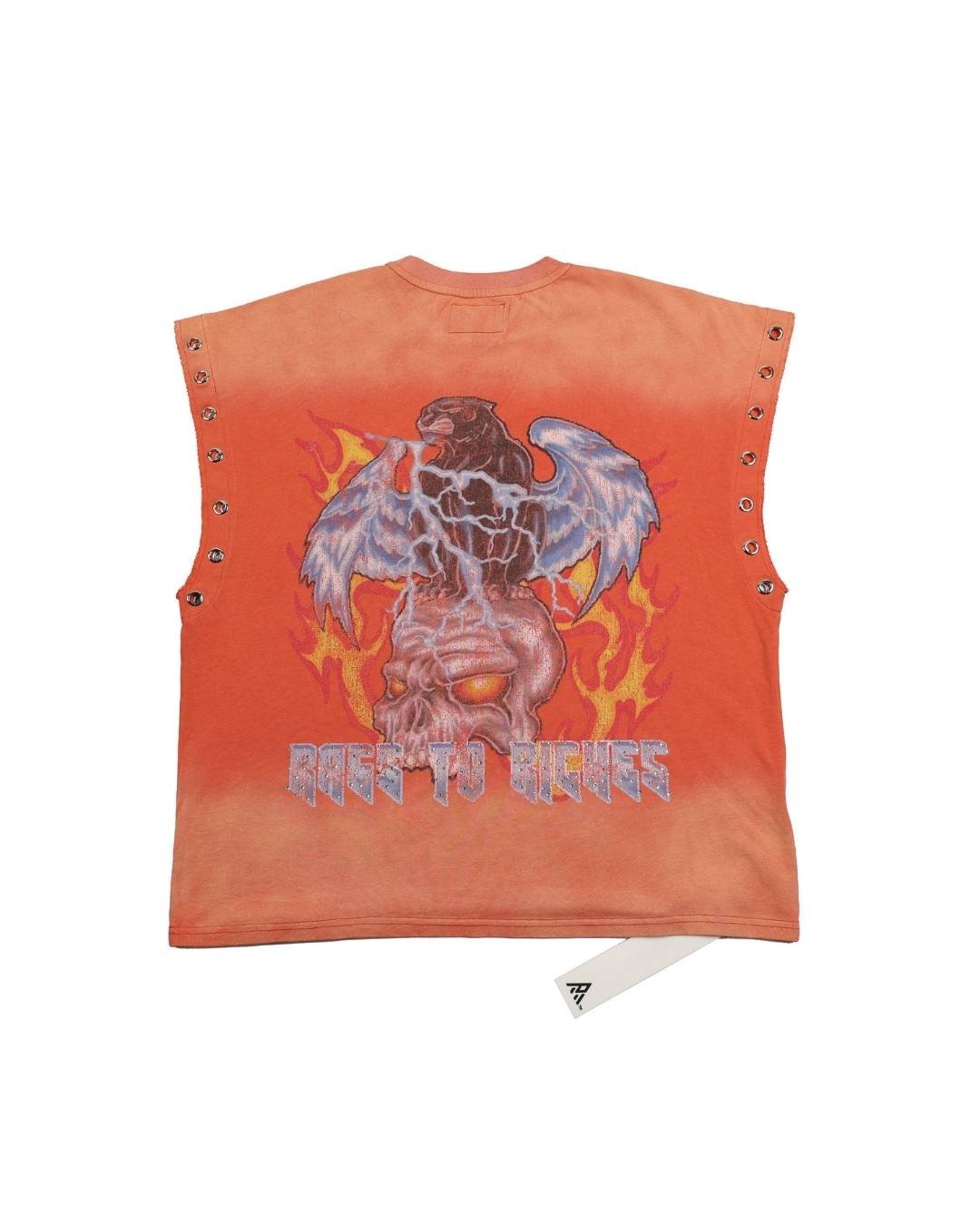 An orange sleeveless crop top with a large graphic of a winged skull and the text 'GOES TO RICHES' on the back, featuring metal eyelets along the sides, shown flat on a white background.