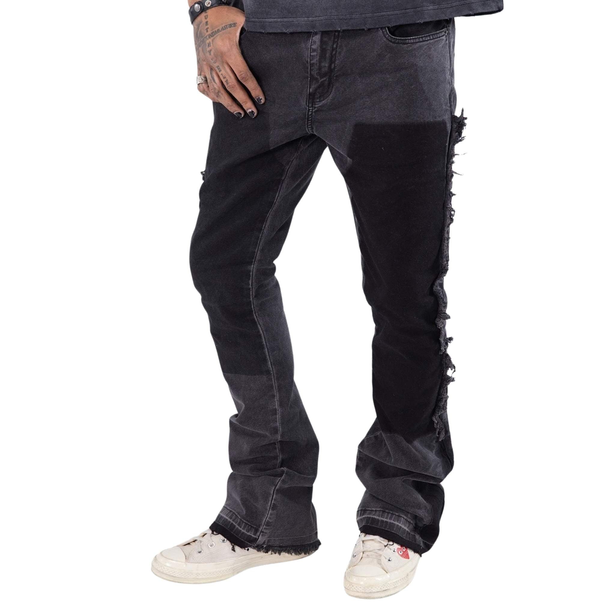 Men’s black carpenter pants with stacked fit and distressed detailing