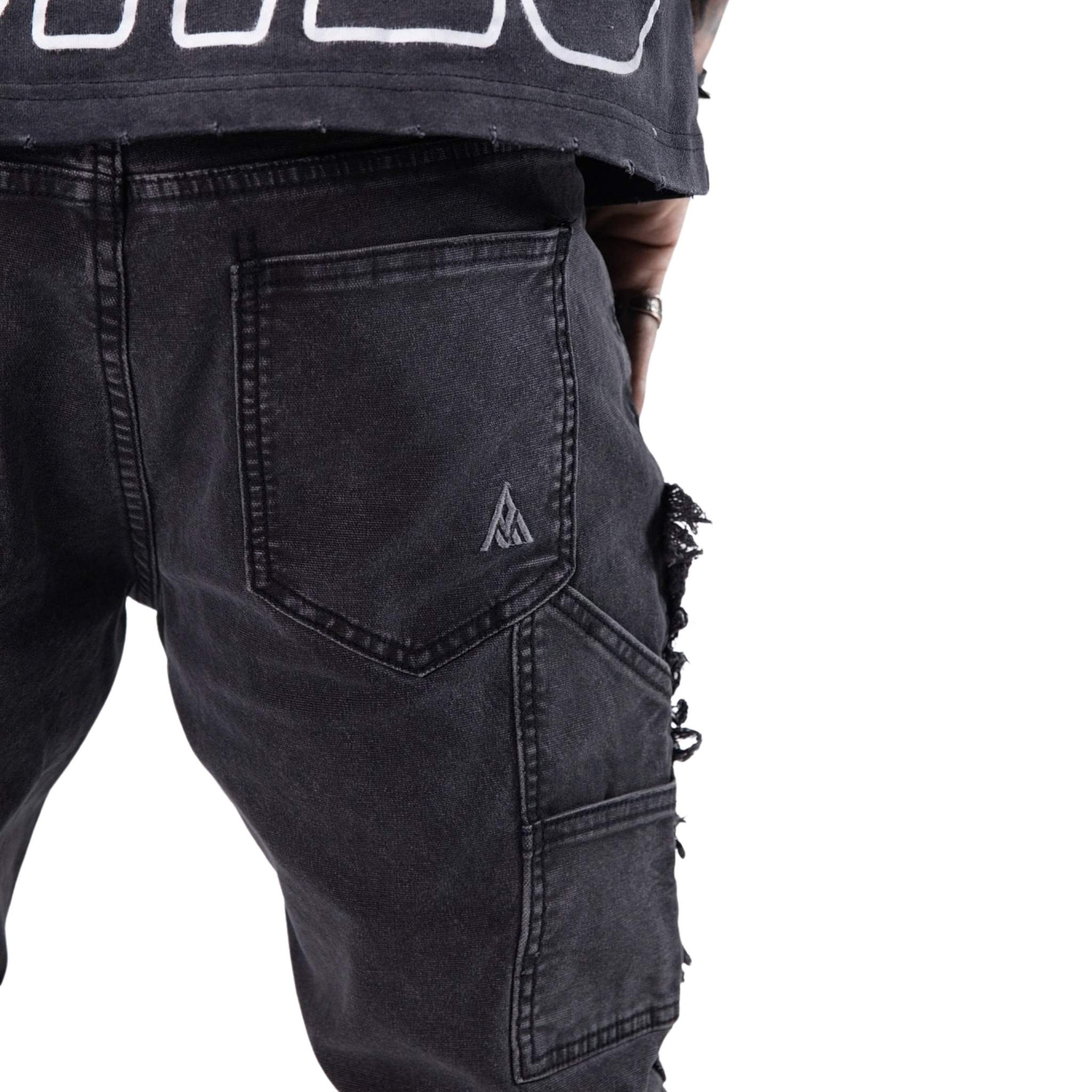 Distressed seam detail on black carpenter pants – heavyweight cotton finish