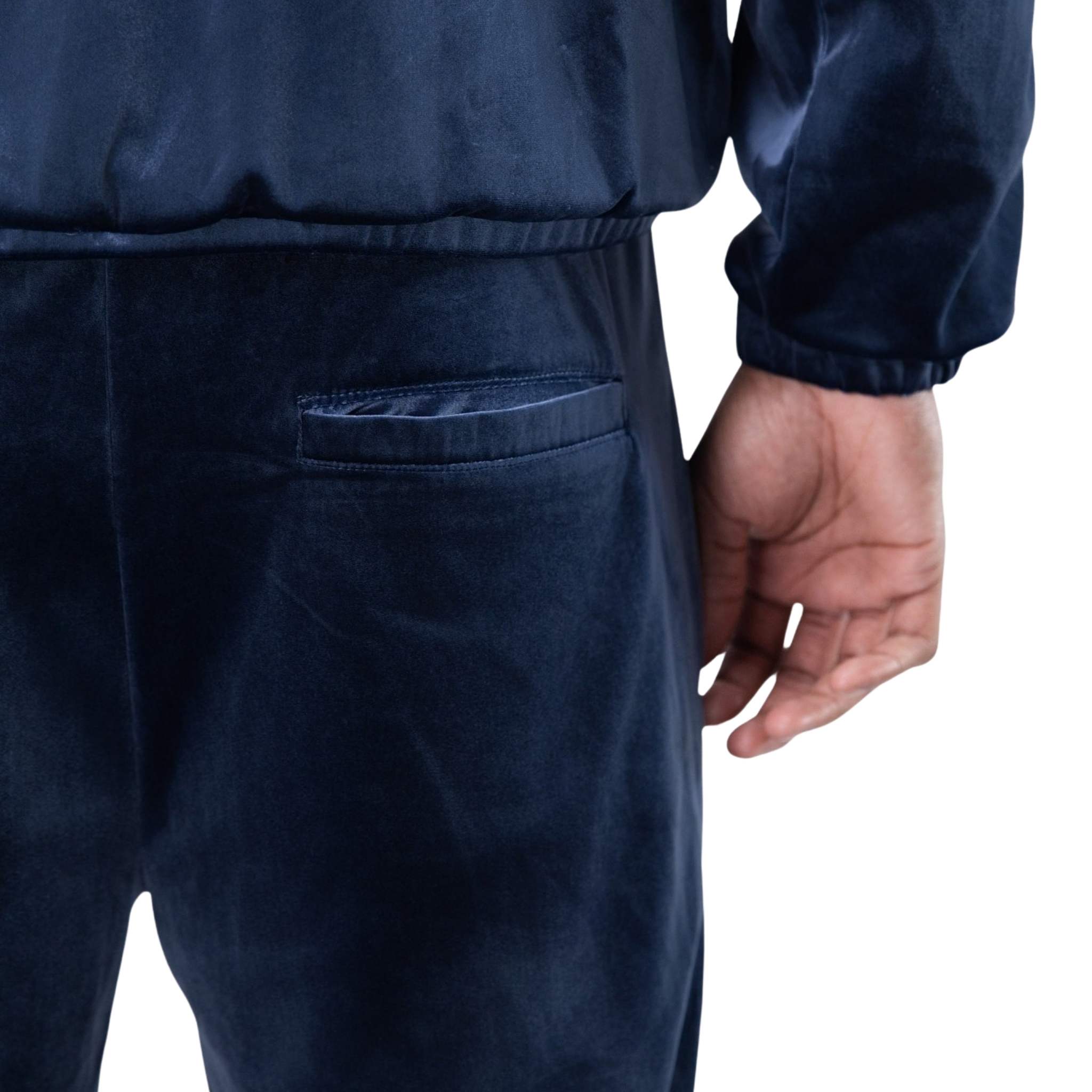 Velour fabric with stud detailing on blue track pants