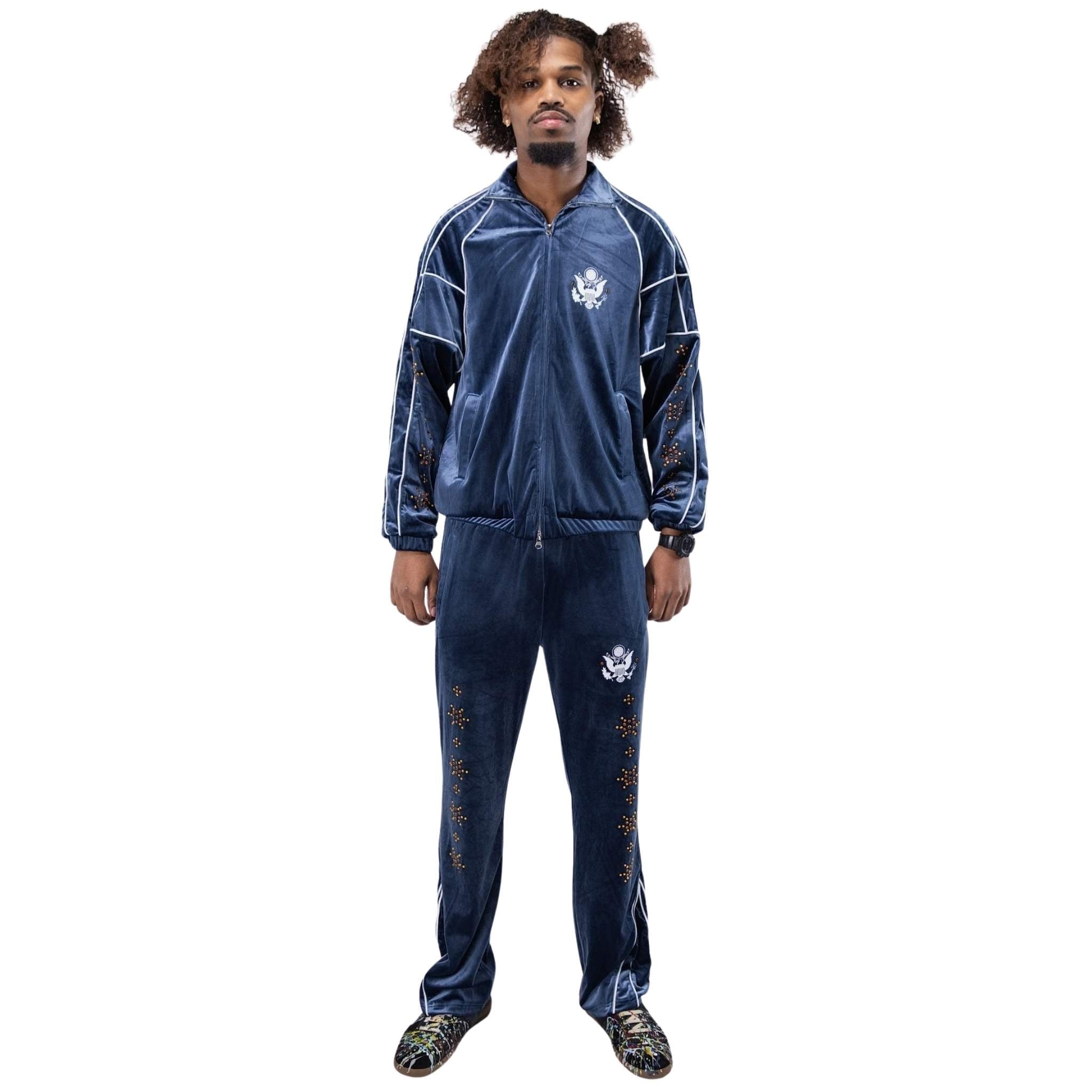 Velour fabric with stud detailing on blue track pants