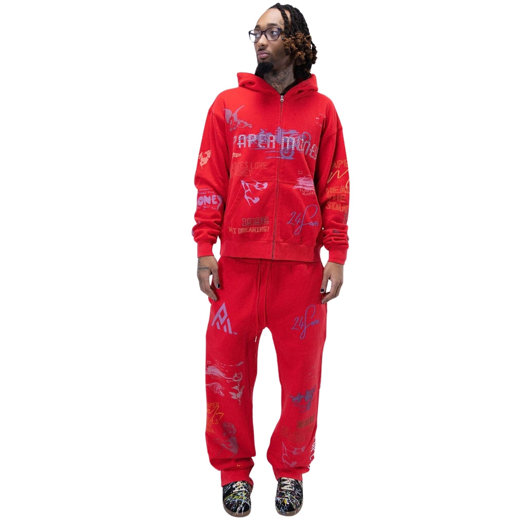 Printed artwork detail on red fleece joggers