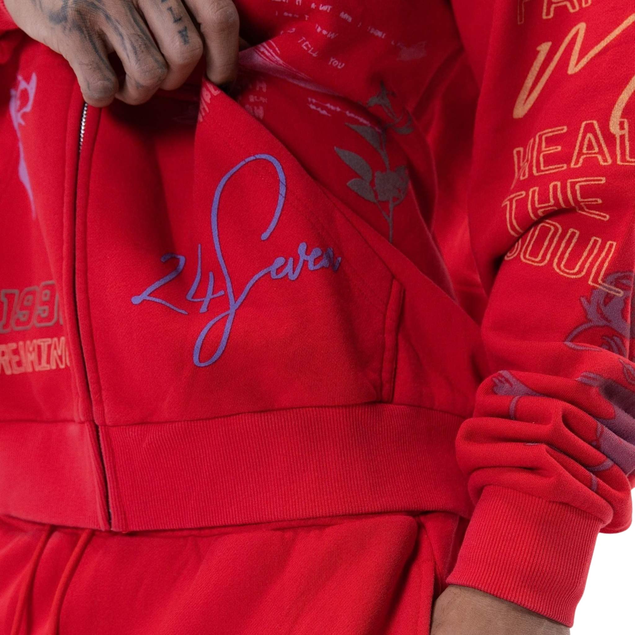 Graphic detail on red zip hoodie with Paper Money branding