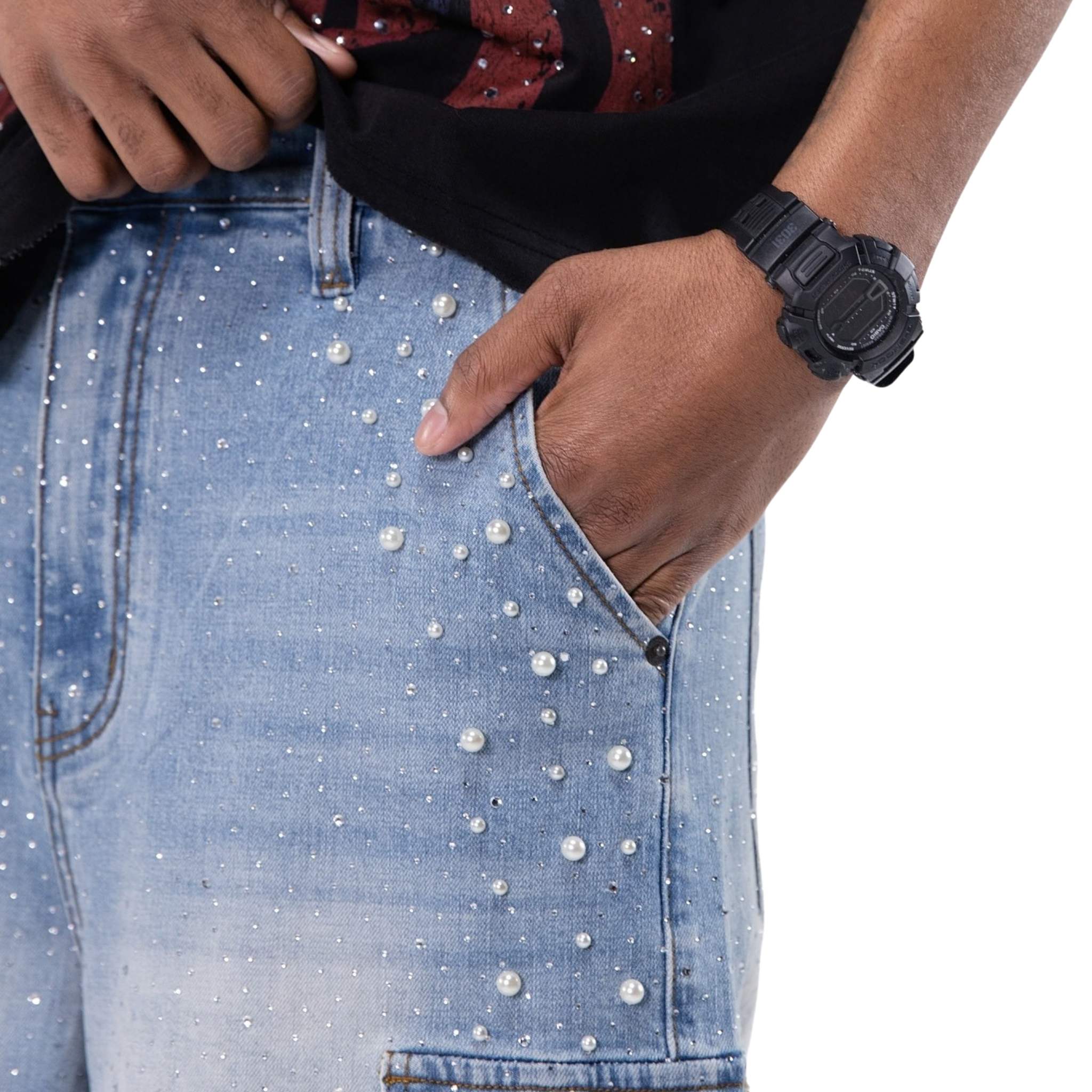 Close-up of pearl and stud embellishments on denim